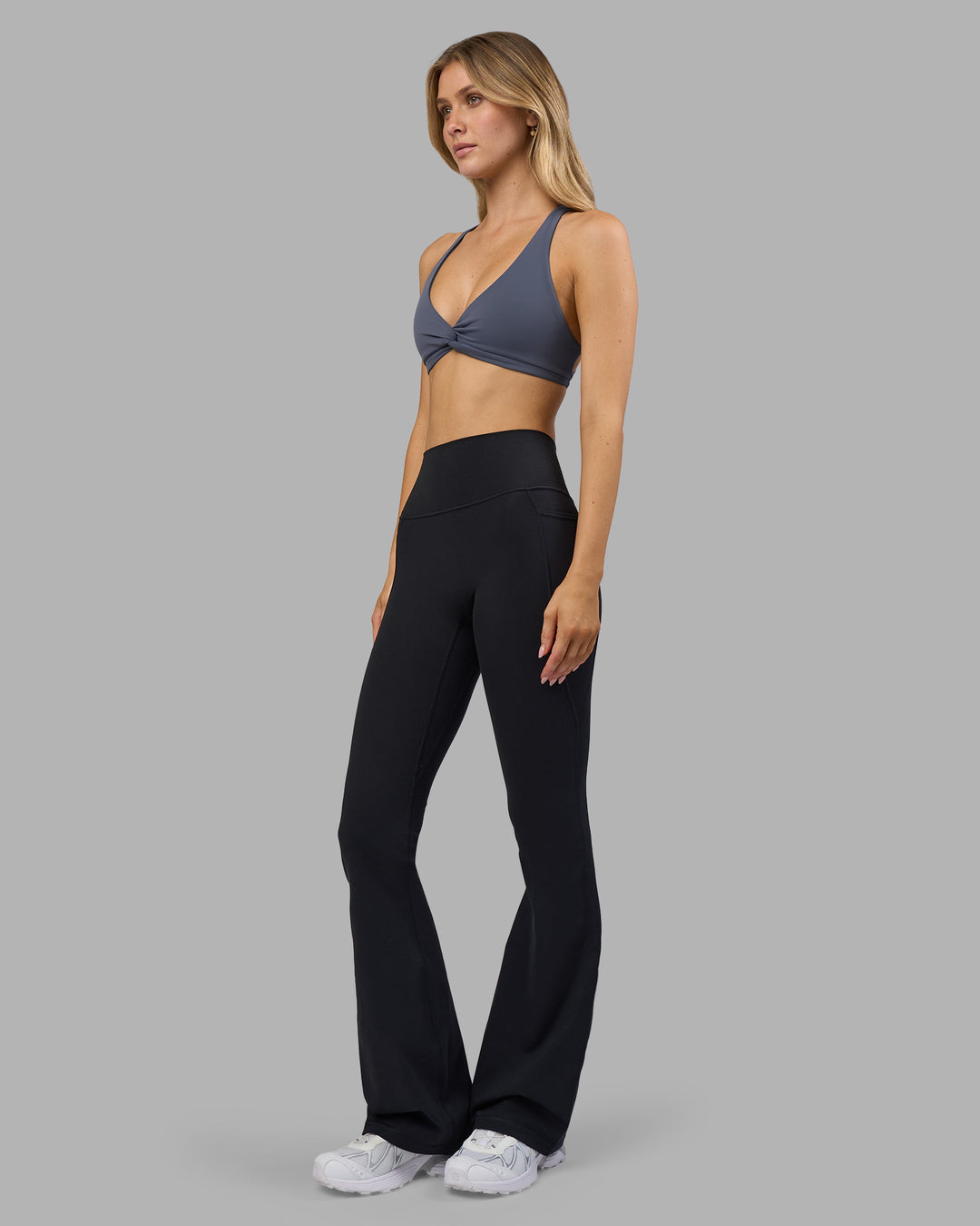 Woman wearing Aspire Twist Sports Bra - Night Shadow | Model:Leilani | Size:XS - view 8