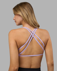 Woman wearing Aspire Twist Sports Bra - Pale Lilac | Model:Leilani | Size:XS | Thumbnail Index: 0