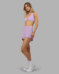 Woman wearing Aspire Twist Sports Bra - Pale Lilac | Model:Leilani | Size:XS | Thumbnail Index: 4