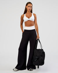 Woman wearing Aspire Twist Sports Bra - White | Model:Brylee | Size:XS | Thumbnail Index: 2