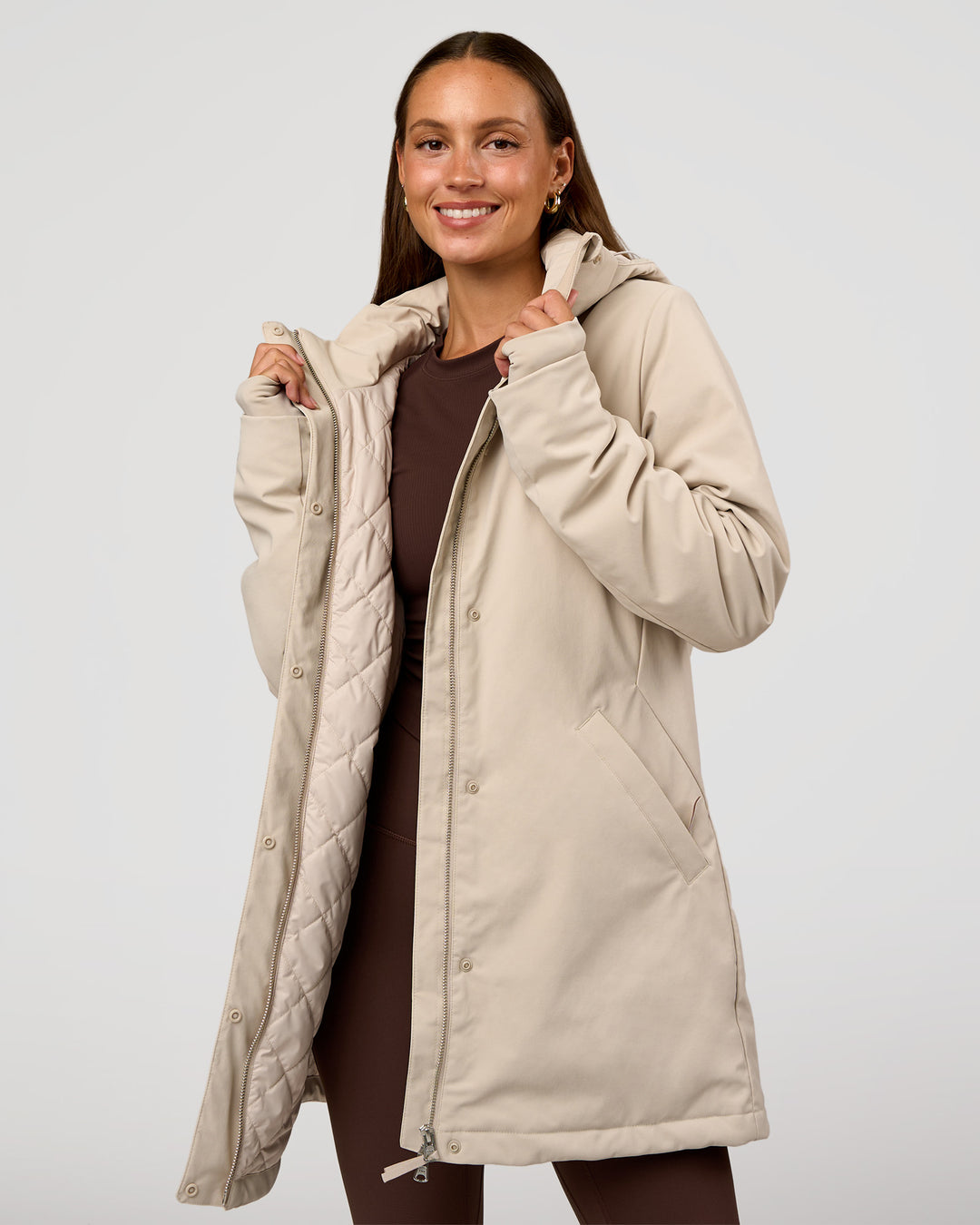 Woman wearing Auxiliary 2.0 Longline Jacket - Shale Beige | Model:Brylee | Size:XS - view 1