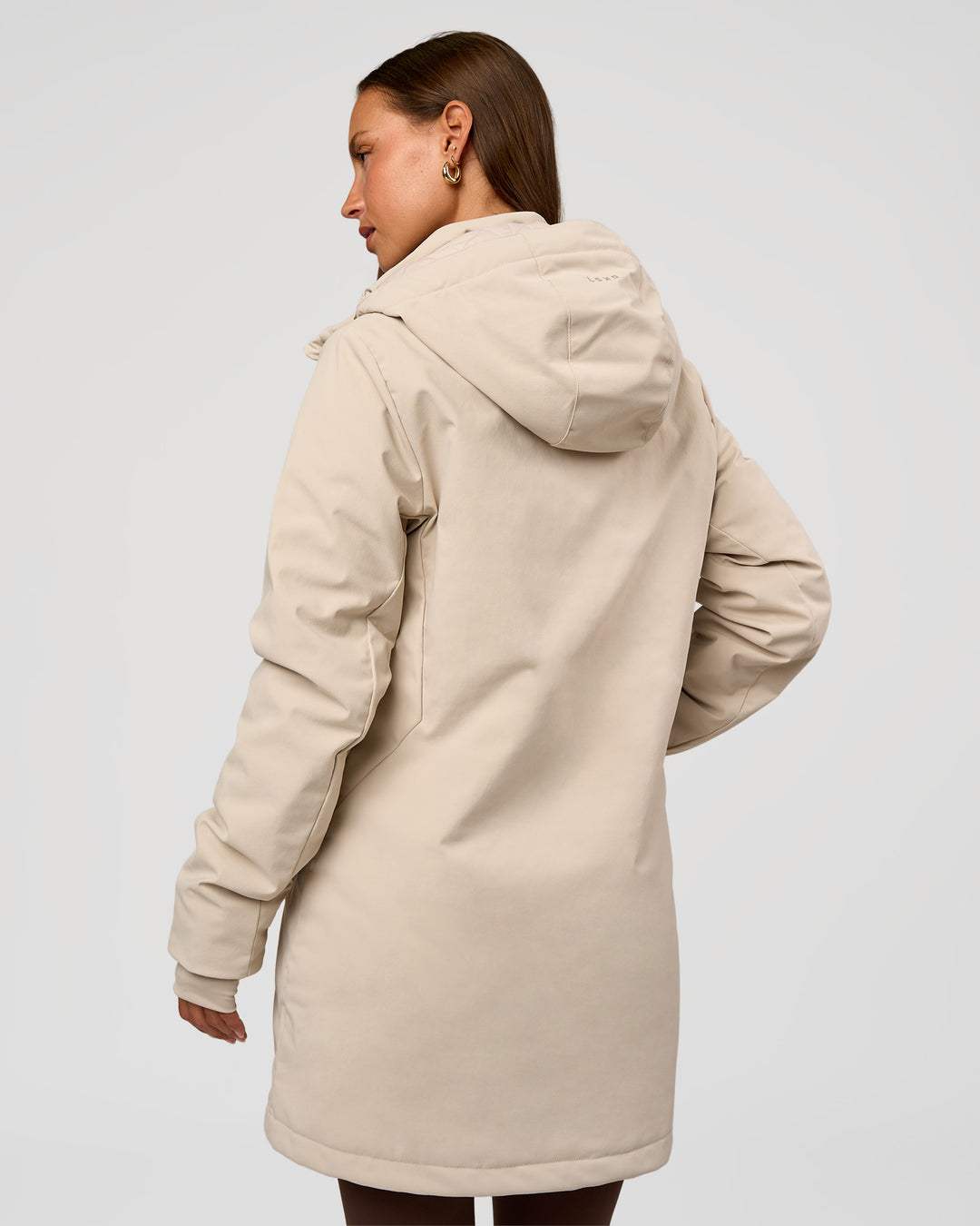 Woman wearing Auxiliary 2.0 Longline Jacket - Shale Beige | Model:Brylee | Size:XS - view 5