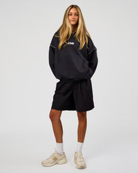 Woman wearing Axis Oversized Hoodie - Caviar-White | Model:Georgia | Size:XS | Thumbnail Index: 4