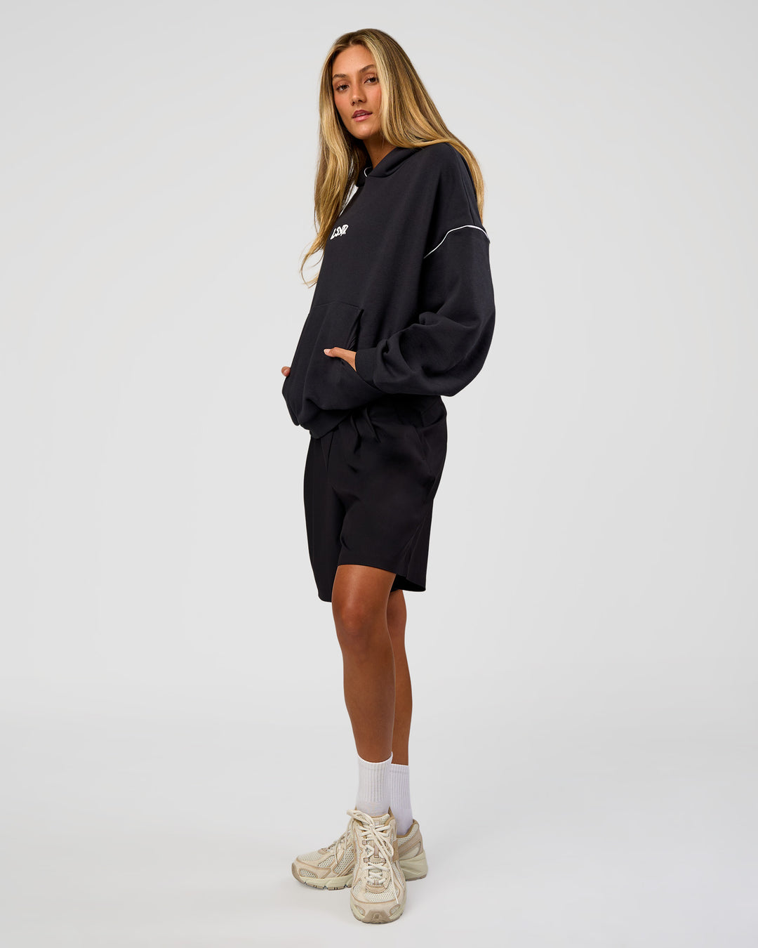 Woman wearing Axis Oversized Hoodie - Caviar-White | Model:Georgia | Size:XS - view 9