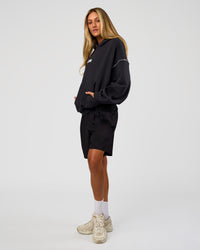 Woman wearing Axis Oversized Hoodie - Caviar-White | Model:Georgia | Size:XS | Thumbnail Index: 8
