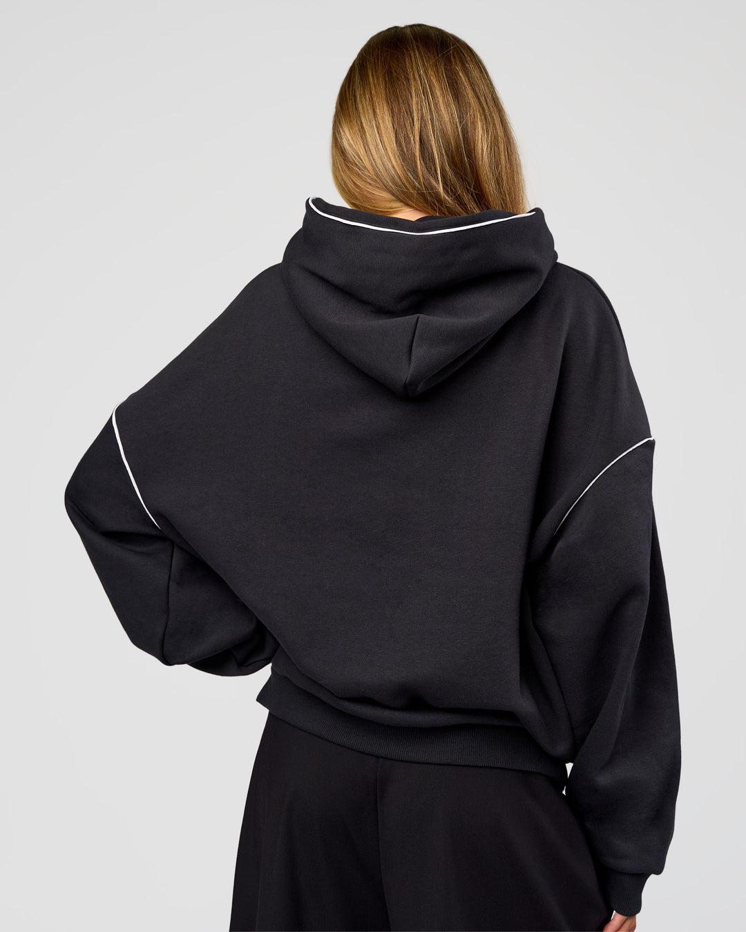 Woman wearing Axis Oversized Hoodie - Caviar-White | Model:Georgia | Size:XS - view 8