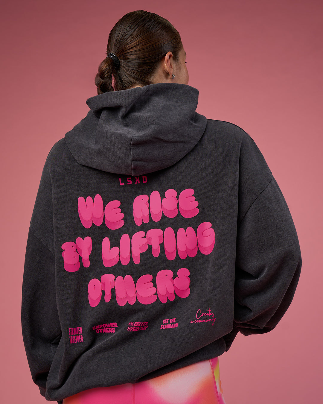 Woman wearing BCAM Washed Unisex Oversized Hoodie - Black Washed-Pink | Model:Hannah | Size:XS - view 3