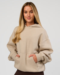 Woman wearing Base Oversized Hoodie - Shale Beige | Model:Issy | Size: XS | | Thumbnail Index: 11