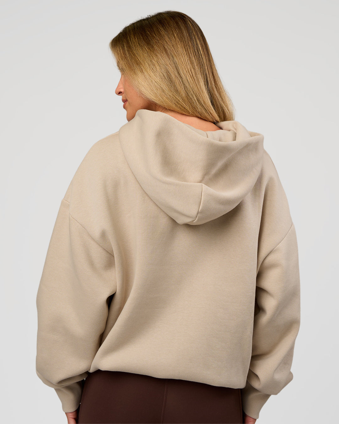 Woman wearing Base Oversized Hoodie - Shale Beige | Model:Issy | Size: XS | - view 13