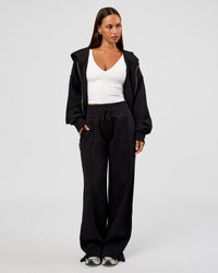 Woman wearing Base Zip Through Oversized Hoodie - Black | Model:Brylee | Size:XS | Thumbnail Index: 10