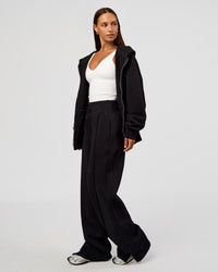 Woman wearing Base Zip Through Oversized Hoodie - Black | Model:Brylee | Size:XS | Thumbnail Index: 7