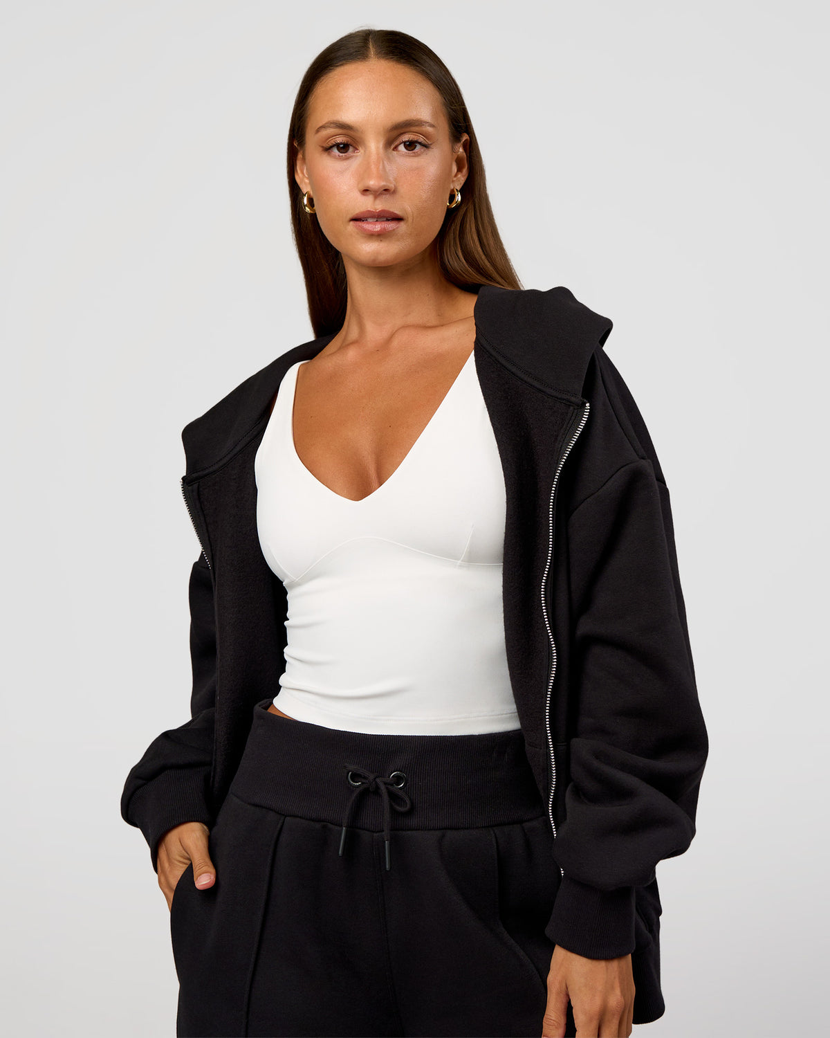 Woman wearing Base Zip Through Oversized Hoodie - Black | Model:Brylee | Size:XS