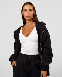 Woman wearing Base Zip Through Oversized Hoodie - Black | Model:Brylee | Size:XS | Thumbnail Index: 1