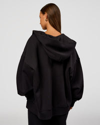 Woman wearing Base Zip Through Oversized Hoodie - Black | Model:Brylee | Size:XS | Thumbnail Index: 4