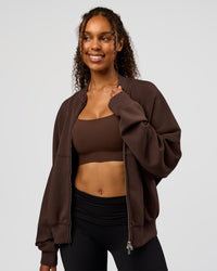 Woman wearing CF Elevate SoftTouch Bomber - Hot Chocolate | Model:Jordan | Size:XS | Thumbnail Index: 14