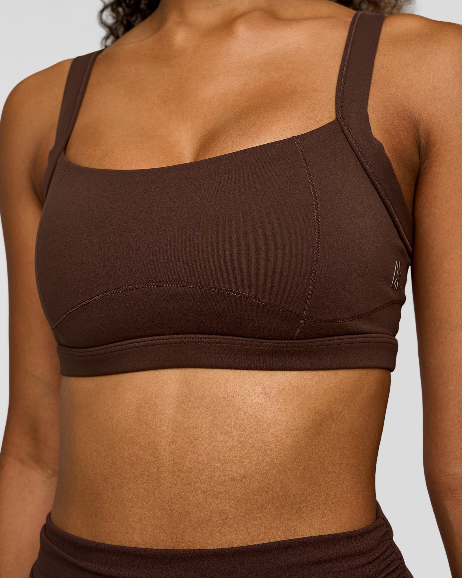 Woman wearing CF Move Through It Sports Bra - Hot Chocolate | Model:Jordan | Size:XS