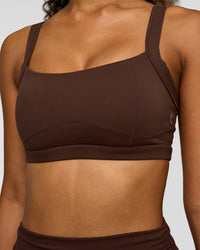 Woman wearing CF Move Through It Sports Bra - Hot Chocolate | Model:Jordan | Size:XS | Thumbnail Index: 0
