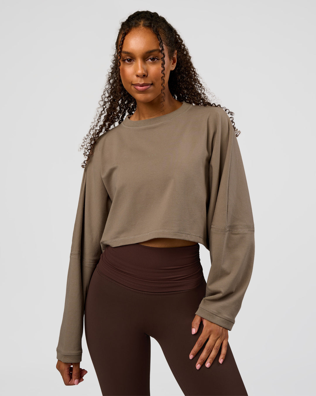 Woman wearing CF Street Surge Long Sleeve Tee - Taupe Ash | Model:Jordan | Size:XS - view 1