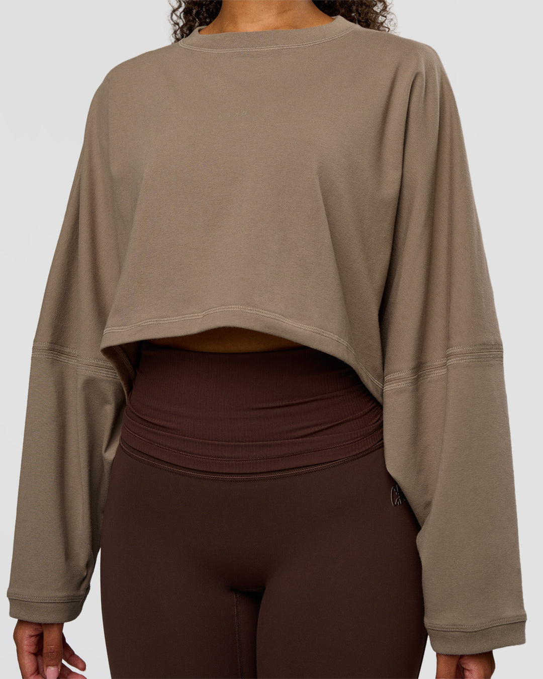 Woman wearing CF Street Surge Long Sleeve Tee - Taupe Ash | Model:Jordan | Size:XS - view 3