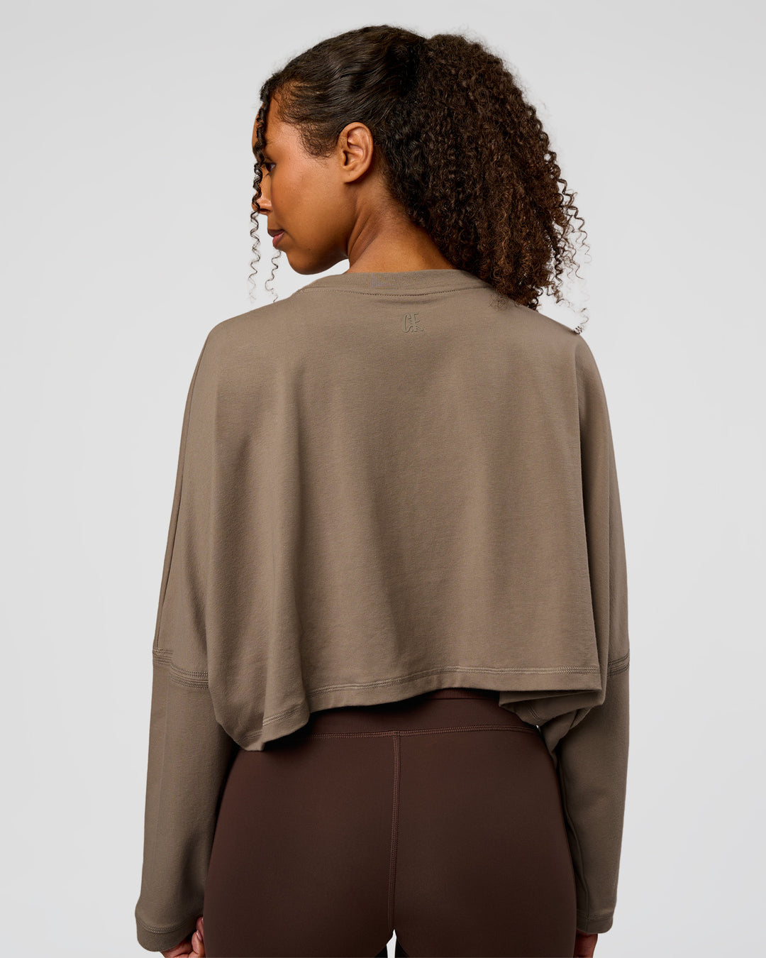 Woman wearing CF Street Surge Long Sleeve Tee - Taupe Ash | Model:Jordan | Size:XS - view 4