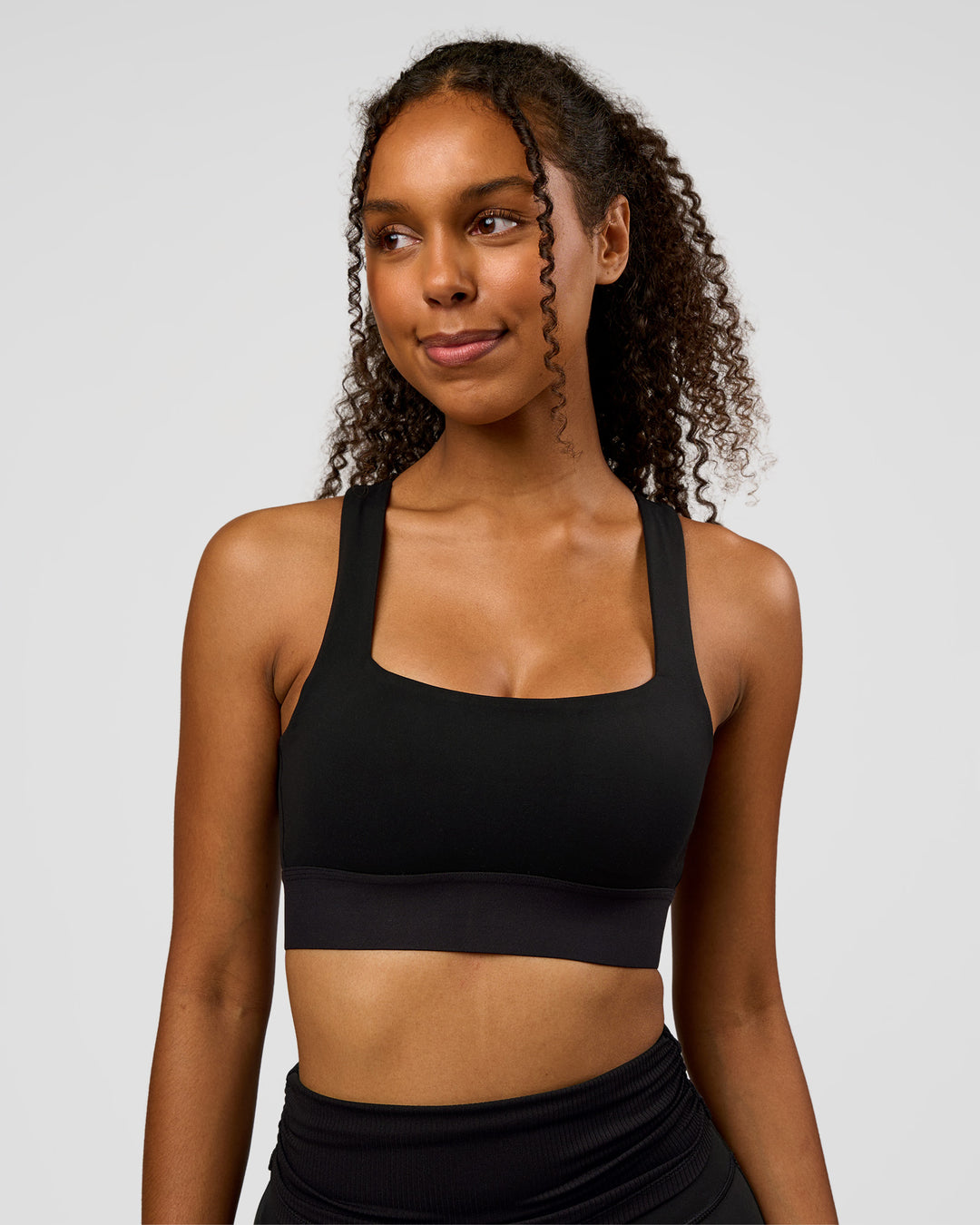 Woman wearing CF Train Hard Sports Bra - Black | Model:Jordan | Size:XS - view 10