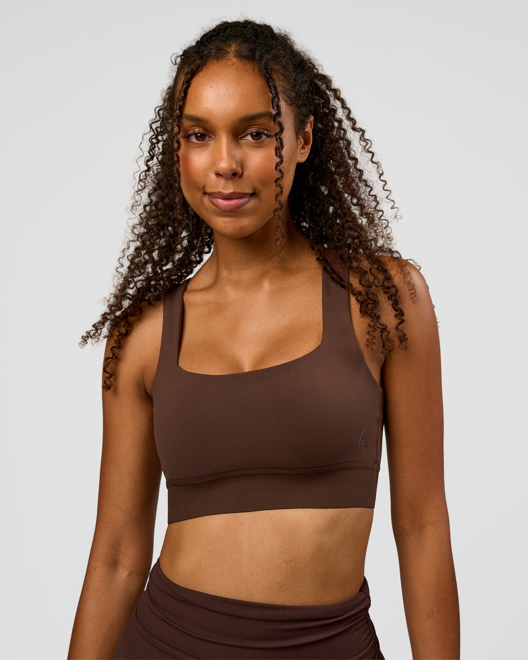 Woman wearing CF Train Hard Sports Bra - Hot Chocolate | Model:Jordan | Size:XS - view 6