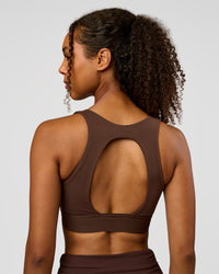 Woman wearing CF Train Hard Sports Bra - Hot Chocolate | Model:Jordan | Size:XS | Thumbnail Index: 1