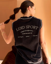 Woman wearing CF Unisex Oversized Heavyweight Boxed Tank - Black-CF X LSKD Sport | Model:Chloe | Size:XS | Thumbnail Index: 2