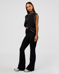 Woman wearing CF Unisex Oversized Heavyweight Boxed Tank - Black-CF X LSKD Sport | Model:Brylee | Size:XS | Thumbnail Index: 6