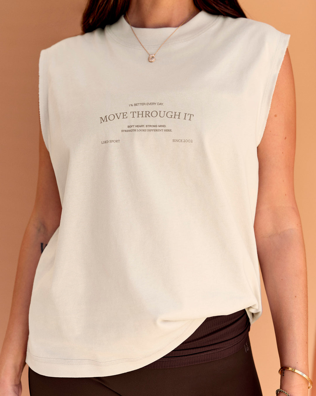 Woman wearing CF Unisex Oversized Heavyweight Boxed Tank - Clay-CF Move Through It | Model:Chloe | Size:XS - view 2