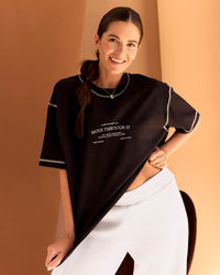 Woman wearing CF Unisex Oversized Heavyweight FLXCotton Tee - Black-CF Move Through It | Model:Chloe | Size:XS | Thumbnail Index: 2