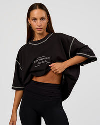 Woman wearing CF Unisex Oversized Heavyweight FLXCotton Tee - Black-CF Move Through It | Model:Brylee | Size:XS | Thumbnail Index: 10