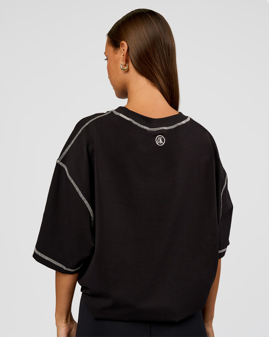 Woman wearing CF Unisex Oversized Heavyweight FLXCotton Tee - Black-CF Move Through It | Model:Brylee | Size:XS - view 7