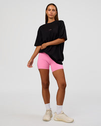Woman wearing CFT BNE 26 FLXCotton Oversized Tee in Black | Model:Brylee | Size:XS | Thumbnail Index: 9