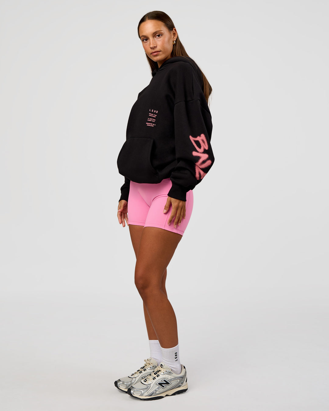 Woman wearing CFT BNE 26 Unisex Oversized Hoodie - Black-Candy Pink | Model:Brylee | Size:XS - view 11