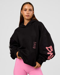 Woman wearing CFT BNE 26 Unisex Oversized Hoodie - Black-Candy Pink | Model:Brylee | Size:XS | Thumbnail Index: 6