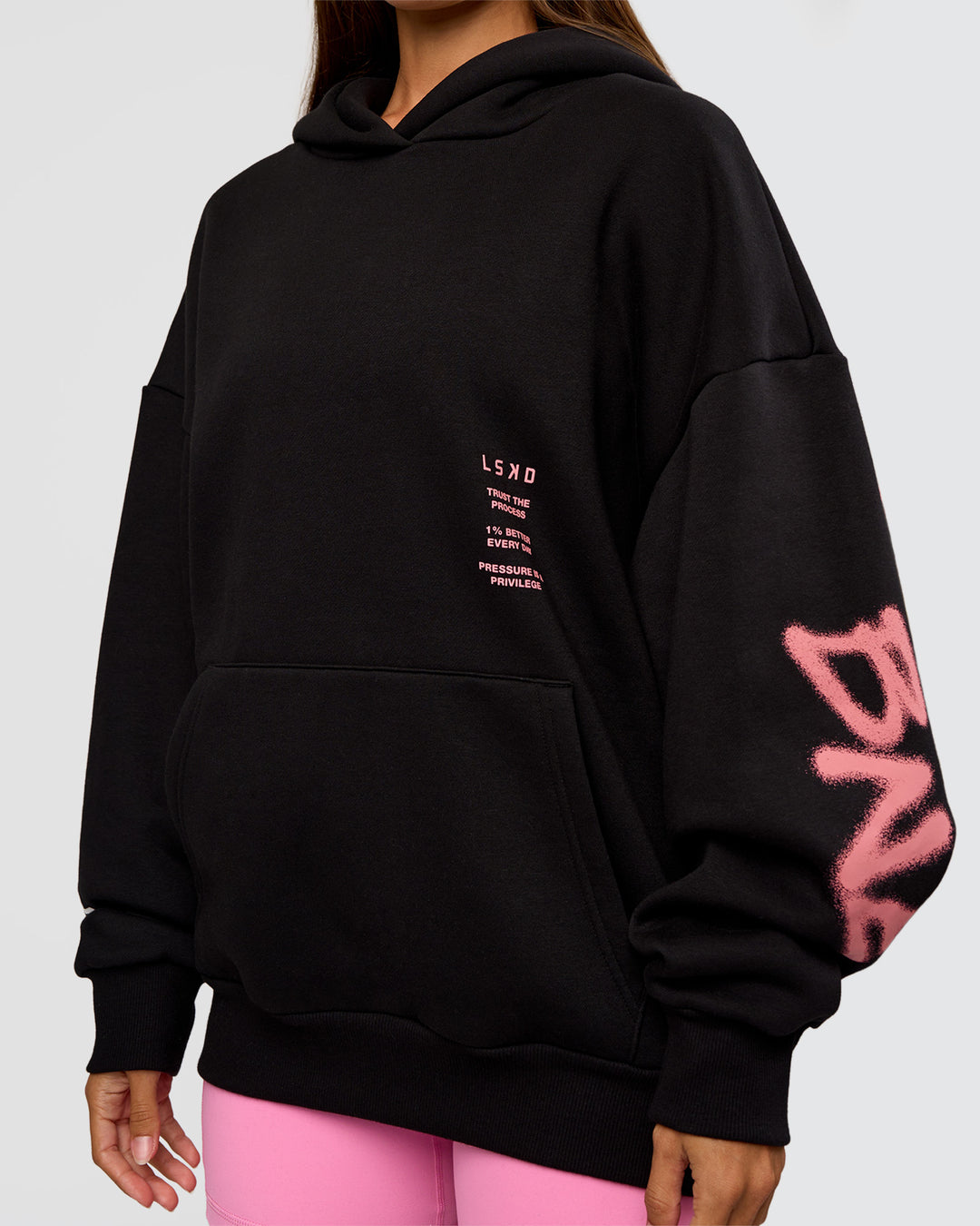 Woman wearing CFT BNE 26 Unisex Oversized Hoodie - Black-Candy Pink | Model:Brylee | Size:XS - view 12