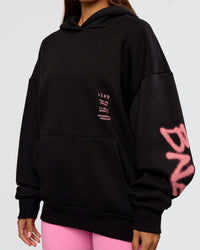 Woman wearing CFT BNE 26 Unisex Oversized Hoodie - Black-Candy Pink | Model:Brylee | Size:XS | Thumbnail Index: 11