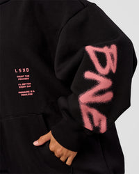Woman wearing CFT BNE 26 Unisex Oversized Hoodie - Black-Candy Pink | Model:Brylee | Size:XS | Thumbnail Index: 12