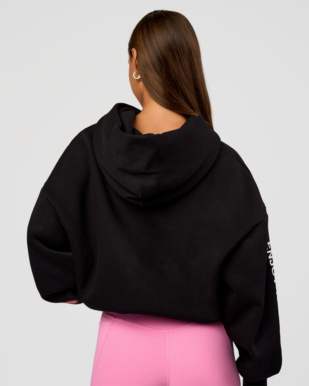 Woman wearing CFT BNE 26 Unisex Oversized Hoodie - Black-Candy Pink | Model:Brylee | Size:XS - view 2
