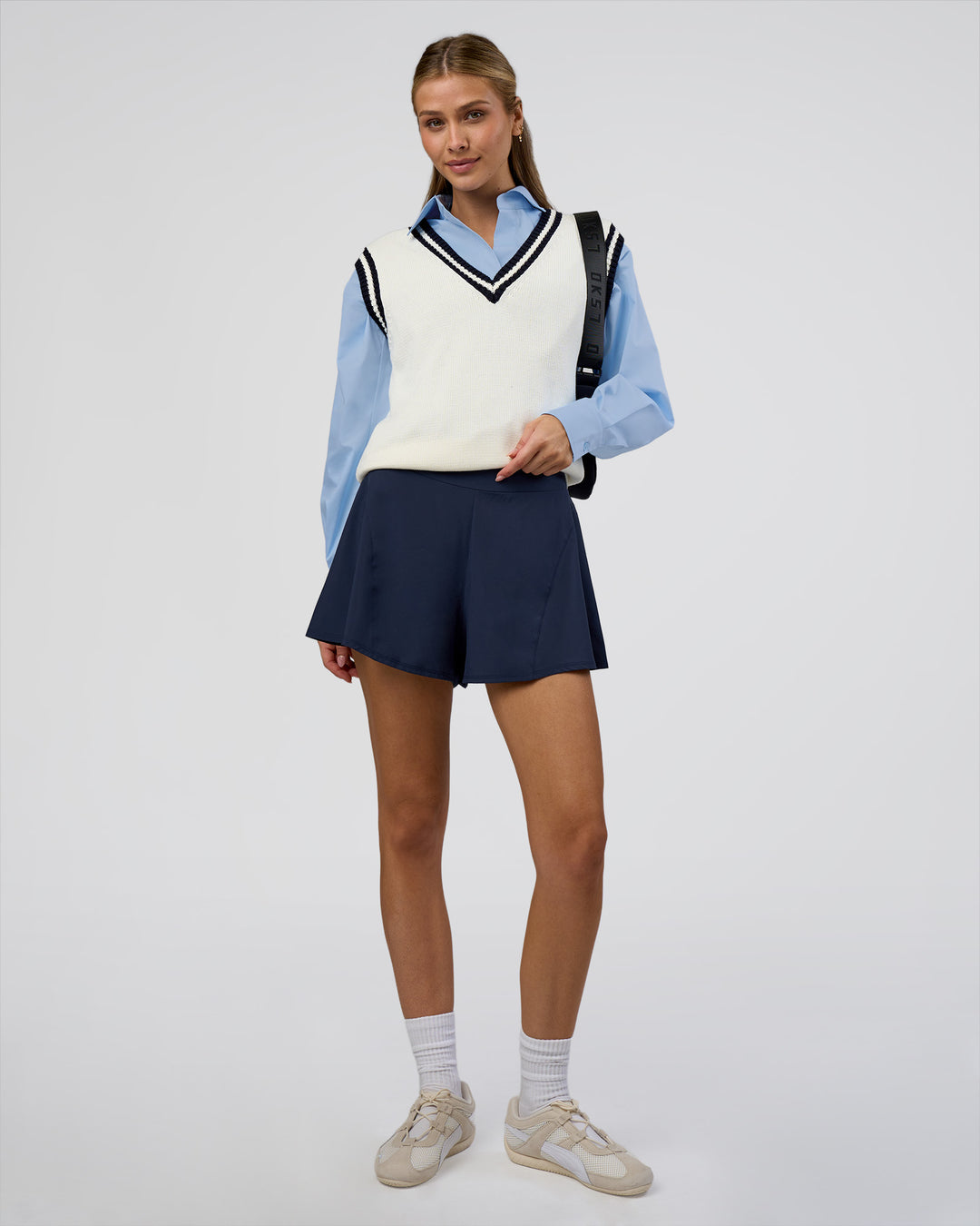 Woman wearing Clubhouse Vest - Off White-Future Navy | Model:Leilani | Size:XS - view 3