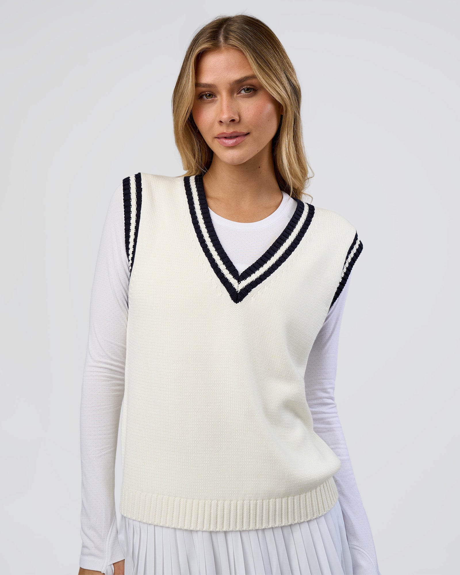 Woman wearing Clubhouse Vest - Off White-Future Navy | Model:Leilani | Size:XS