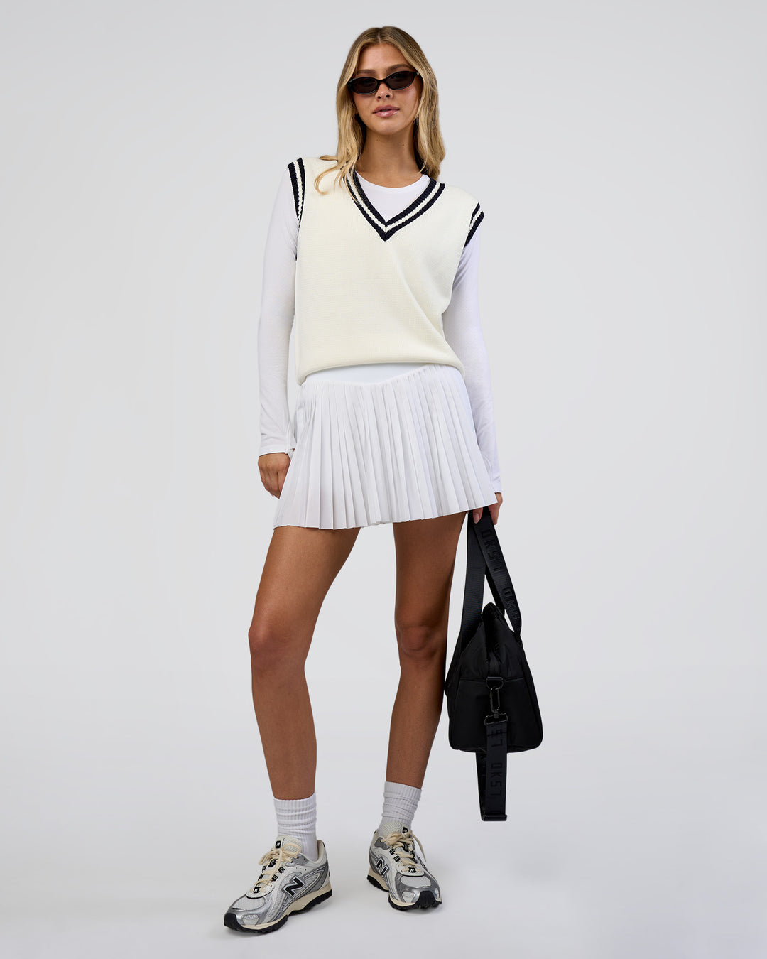Woman wearing Clubhouse Vest - Off White-Future Navy | Model:Leilani | Size:XS - view 6