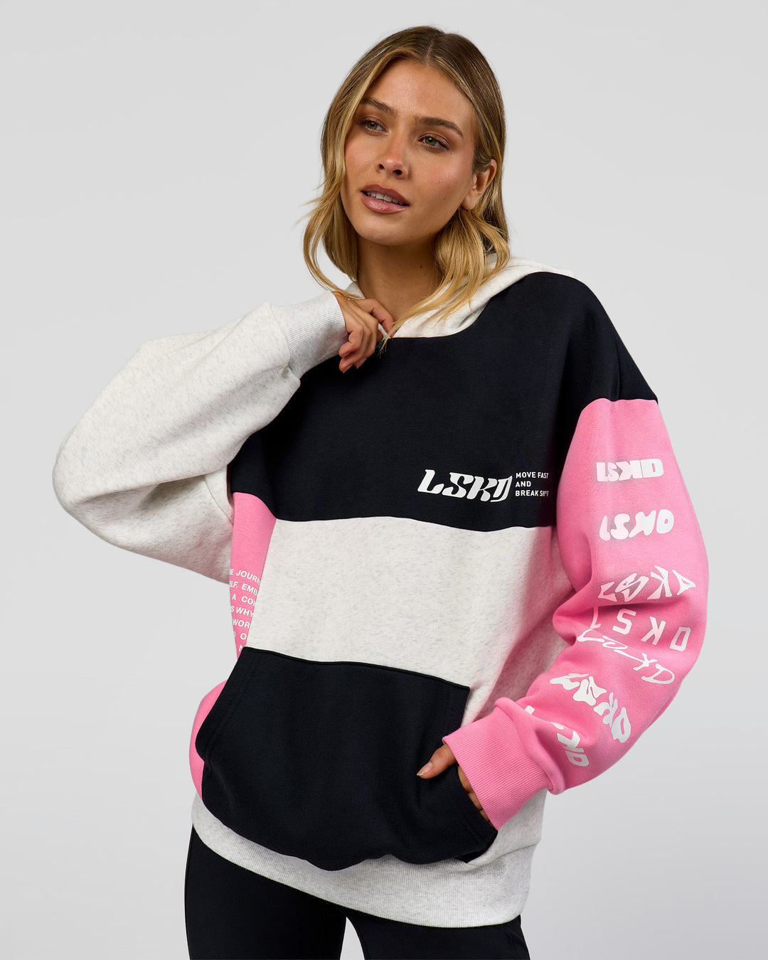 Woman wearing Deconstructed Fleece Hoodie - Caviar-Candy Pink-Grey Marl | Model:Leilani | Size:XS - view 2