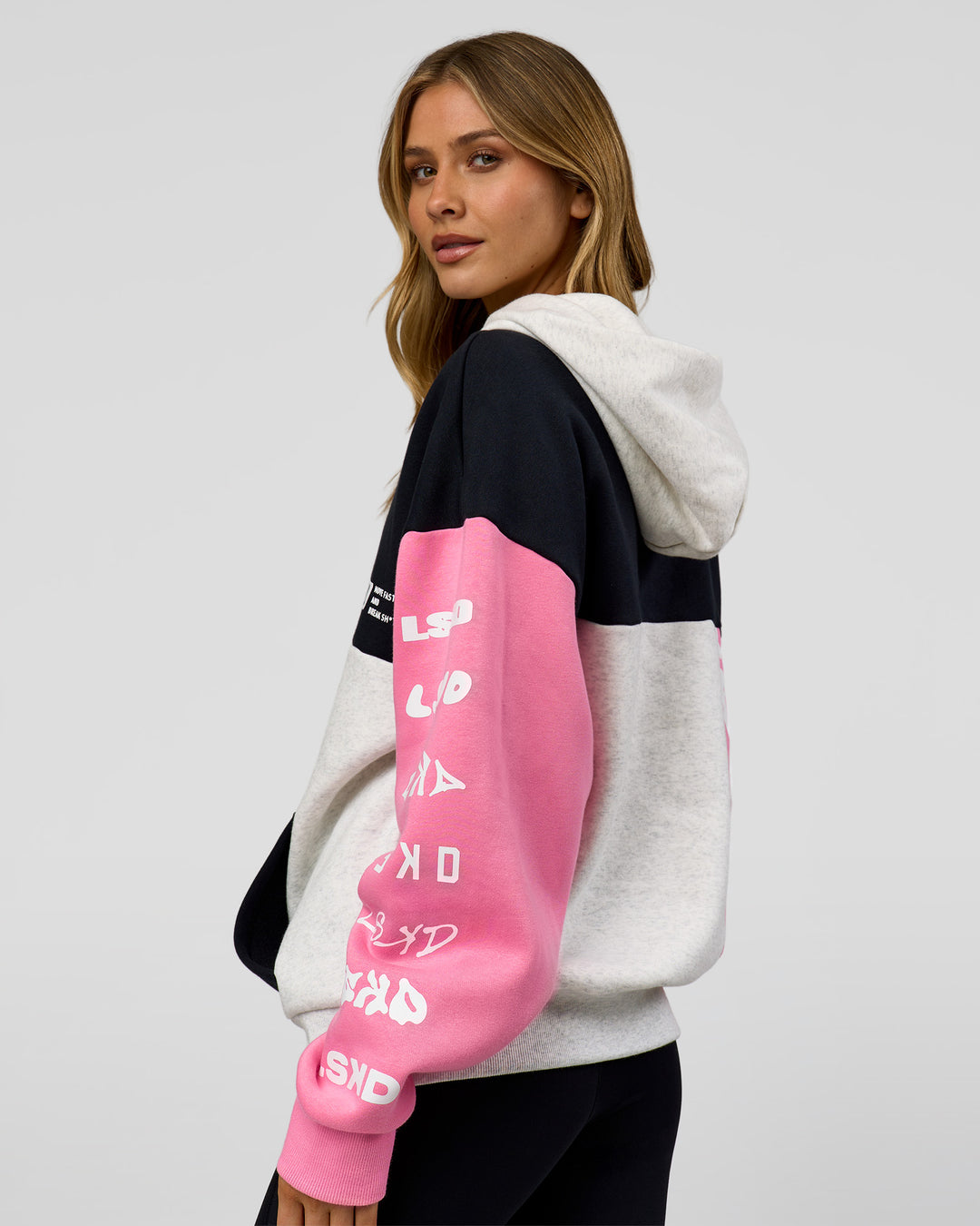 Woman wearing Deconstructed Fleece Hoodie - Caviar-Candy Pink-Grey Marl | Model:Leilani | Size:XS - view 7