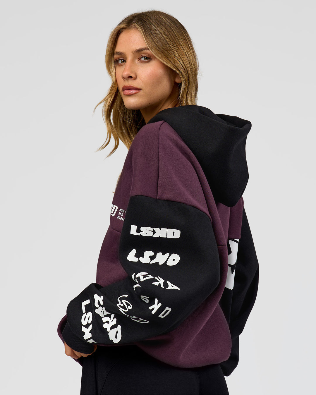 Woman wearing Deconstructed Fleece Hoodie - Caviar-Midnight Plum | Model:Leilani | Size:XS - view 5