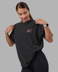 Woman wearing Digital World Heavyweight Oversized Tee - Washed Black | Model:Hannah | Size:XS | Thumbnail Index: 3