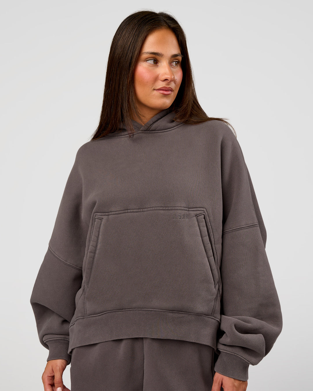 Woman wearing Distort Oversized Hoodie - Duskstone Washed | Model:Bianca | Size:XS - view 1