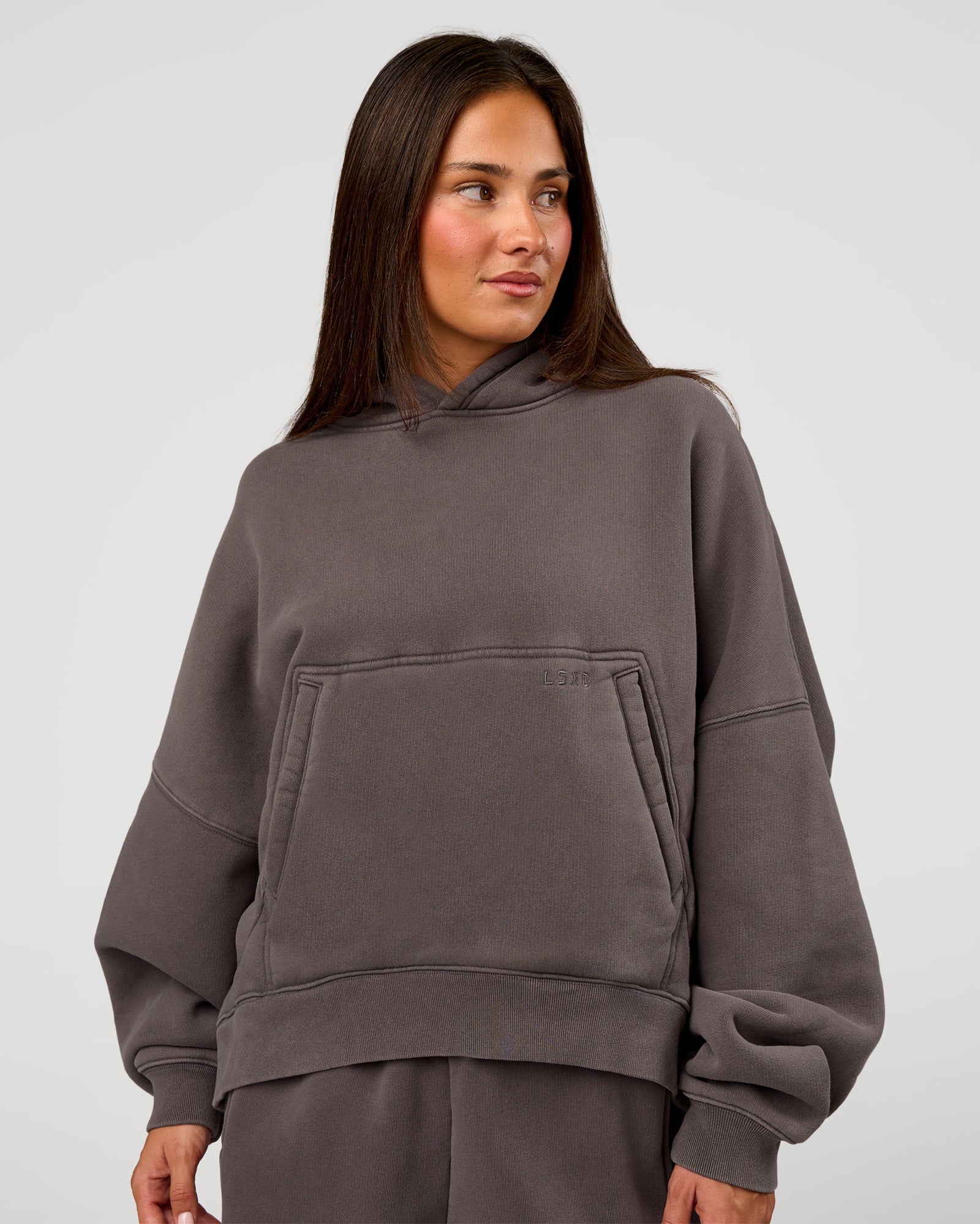 Woman wearing Distort Oversized Hoodie - Duskstone Washed | Model:Bianca | Size:XS