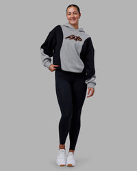 Woman wearing Downtown Oversized Panel Hoodie - Circular Grey - Black | Model:Remmi | Size:XS | Thumbnail Index: 4